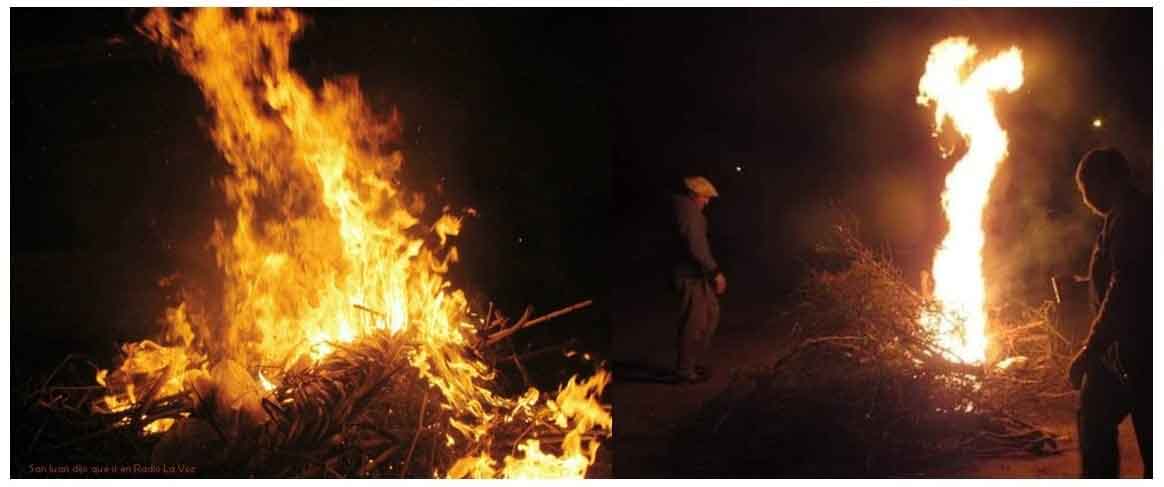 Los trenelenses, Marcos y Élbio, encendiendo la fogata en la noche del 23 de junio.